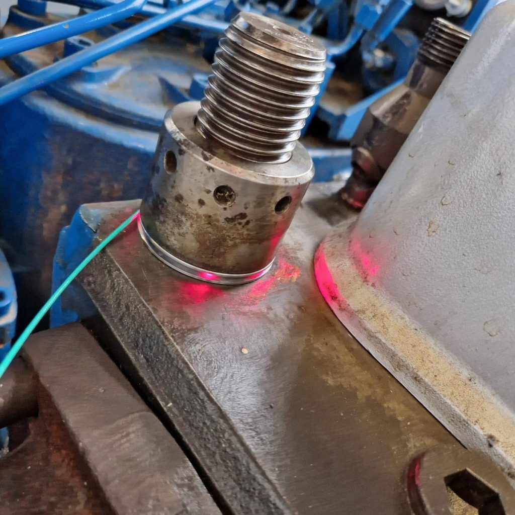 Retrofittable optical washer to measure strain and related that to cylinder pressure